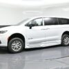White Chrysler Pacifica with BraunAbility Side Entry Automatic Fold Out conversion