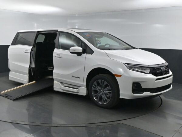 White Honda Odyssey with BraunAbility Side Entry Automatic In Floor conversion