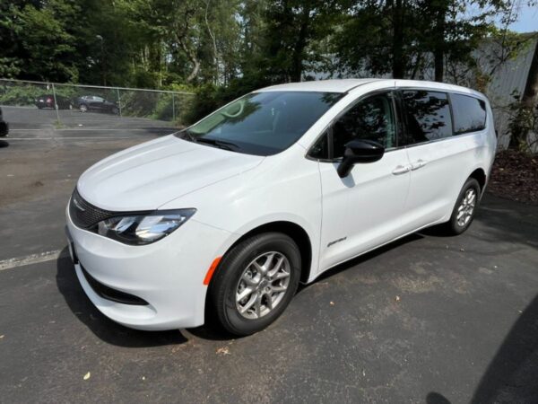 White Chrysler Voyager with Driverge Side Entry Automatic Fold Out conversion