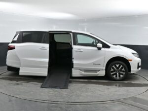 White Honda Odyssey with BraunAbility Side Entry Automatic In Floor conversion