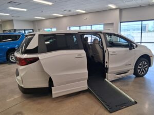 White Honda Odyssey with BraunAbility Side Entry Automatic In Floor conversion