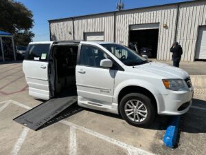 White Dodge Grand Caravan with BraunAbility Side Entry Automatic In Floor conversion