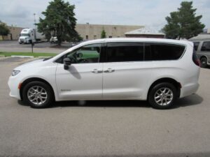 White Chrysler Pacifica with Driverge Side Entry Automatic Fold Out conversion