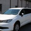 White Chrysler Voyager with BraunAbility Rear Entry Manual Fold Out conversion