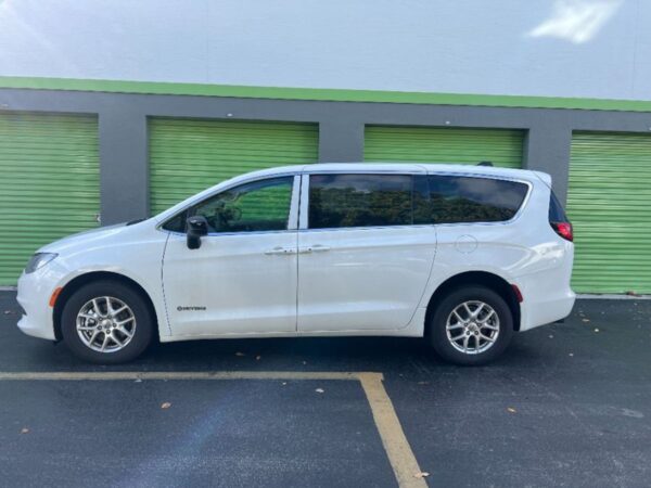 White Chrysler Voyager with Driverge Side Entry Automatic Fold Out conversion