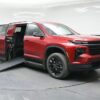 Red Chevrolet Traverse with BraunAbility Side Entry Automatic In Floor conversion