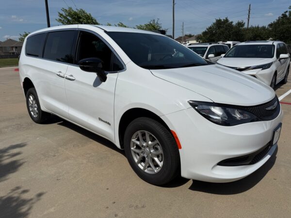 White Chrysler Voyager with BraunAbility Rear Entry Manual Fold Out conversion