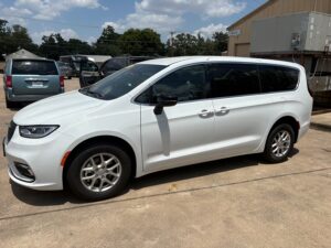 White Chrysler Pacifica with Driverge Side Entry Automatic Fold Out conversion