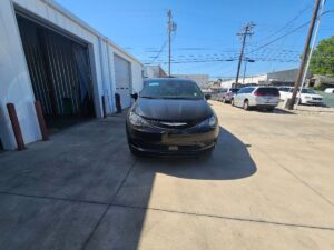Black Chrysler Voyager with BraunAbility Side Entry Automatic Fold Out conversion