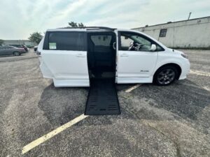 White Toyota Sienna with BraunAbility Side Entry Automatic Fold Out conversion