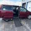 Red Dodge Grand Caravan with Adaptive Vans Side Entry Automatic Fold Out conversion