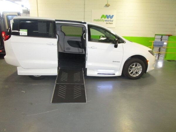 White Chrysler Voyager with Driverge Side Entry Automatic Fold Out conversion
