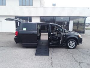 Black Dodge Grand Caravan with BraunAbility Side Entry Automatic Fold Out conversion