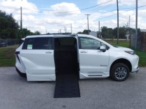 White Toyota Sienna with BraunAbility Side Entry Automatic Fold Out conversion