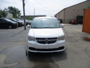 White Dodge Grand Caravan with Driverge Side Entry Automatic Fold Out conversion
