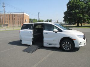 White Honda Odyssey with BraunAbility Side Entry Automatic In Floor conversion