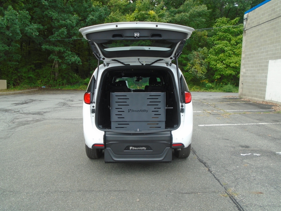 White Chrysler Voyager with BraunAbility Rear Entry Manual Fold Out conversion
