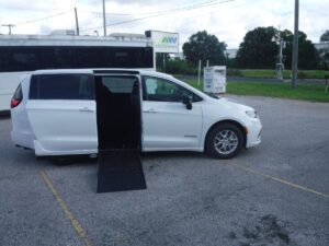 White Chrysler Pacifica with Driverge Side Entry Automatic Fold Out conversion