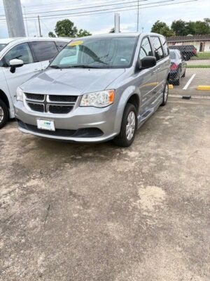 Silver Dodge Grand Caravan with BraunAbility Side Entry Automatic Fold Out conversion
