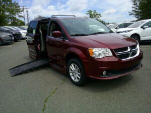 Red Dodge Grand Caravan with BraunAbility Side Entry Automatic Fold Out conversion