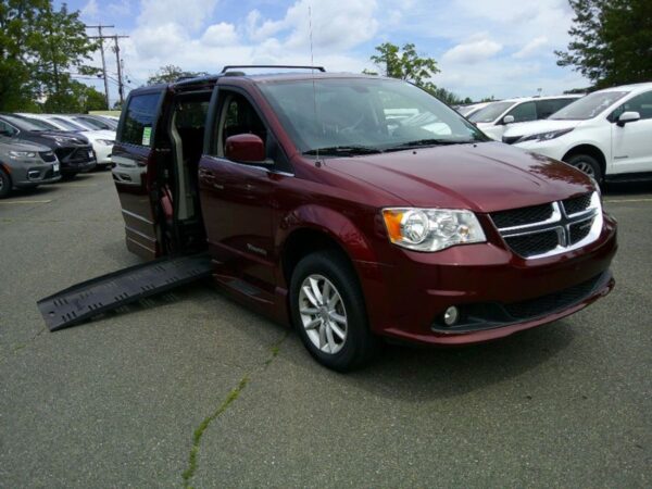 Red Dodge Grand Caravan with BraunAbility Side Entry Automatic Fold Out conversion