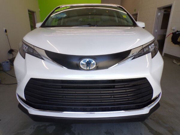 White Toyota Sienna with BraunAbility Side Entry Automatic Fold Out conversion