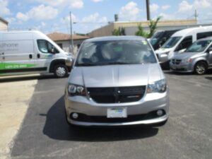 Silver Dodge Grand Caravan with Driverge Side Entry Automatic Fold Out conversion