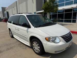 White Chrysler Town and Country with BraunAbility Side Entry Automatic Fold Out conversion
