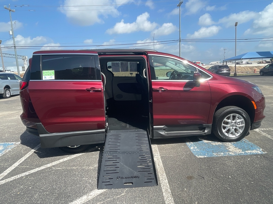 Red Chrysler Voyager with BraunAbility Side Entry Manual Fold Out conversion