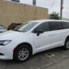 White Chrysler Voyager with BraunAbility Rear Entry Manual Fold Out conversion