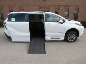 White Toyota Sienna with BraunAbility Side Entry Automatic Fold Out conversion