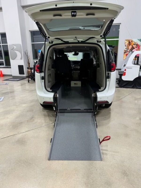 White Chrysler Pacifica with Driverge Rear Entry Manual Fold Out conversion