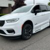 White Chrysler Pacifica with BraunAbility Side Entry Automatic Fold Out conversion