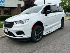 White Chrysler Pacifica with BraunAbility Side Entry Automatic Fold Out conversion