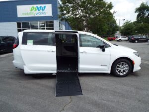 White Chrysler Voyager with Driverge Side Entry Automatic Fold Out conversion