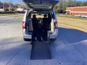 Silver Chrysler Town and Country with BraunAbility Rear Entry Manual Fold Out conversion