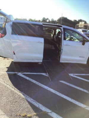 White Chrysler Pacifica with Driverge Side Entry Automatic Fold Out conversion