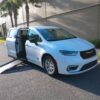 White Chrysler Pacifica with Driverge Side Entry Automatic Fold Out conversion