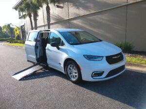 White Chrysler Pacifica with Driverge Side Entry Automatic Fold Out conversion