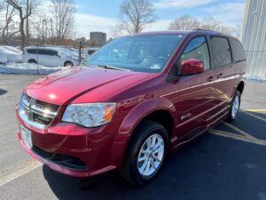 Red Dodge Grand Caravan with BraunAbility Side Entry Automatic Fold Out conversion