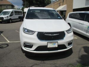 White Chrysler Pacifica with BraunAbility Side Entry Automatic Fold Out conversion