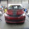 Red Chrysler Voyager with BraunAbility Side Entry Automatic In Floor conversion