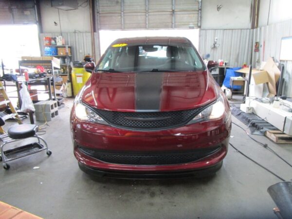 Red Chrysler Voyager with BraunAbility Side Entry Automatic In Floor conversion