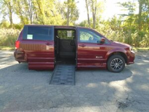 Red Dodge Grand Caravan with BraunAbility Side Entry Automatic Fold Out conversion