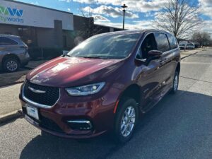 Red Chrysler Pacifica with Driverge Side Entry Automatic Fold Out conversion