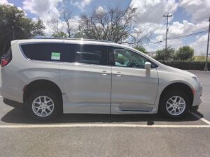 White Chrysler Pacifica with BraunAbility Side Entry Automatic Fold Out conversion