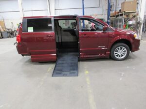 Red Dodge Grand Caravan with BraunAbility Side Entry Automatic Fold Out conversion