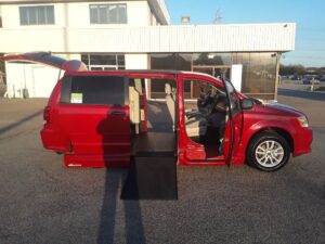 Red Dodge Grand Caravan with Vantage Mobility Side Entry Automatic In Floor conversion