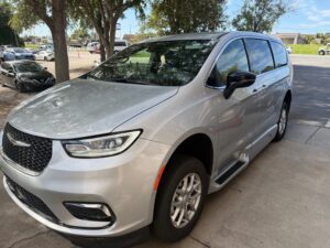 Silver Chrysler Pacifica with BraunAbility Side Entry Automatic Fold Out conversion