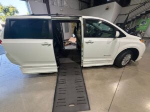 White Toyota Sienna with BraunAbility Side Entry Automatic Fold Out conversion